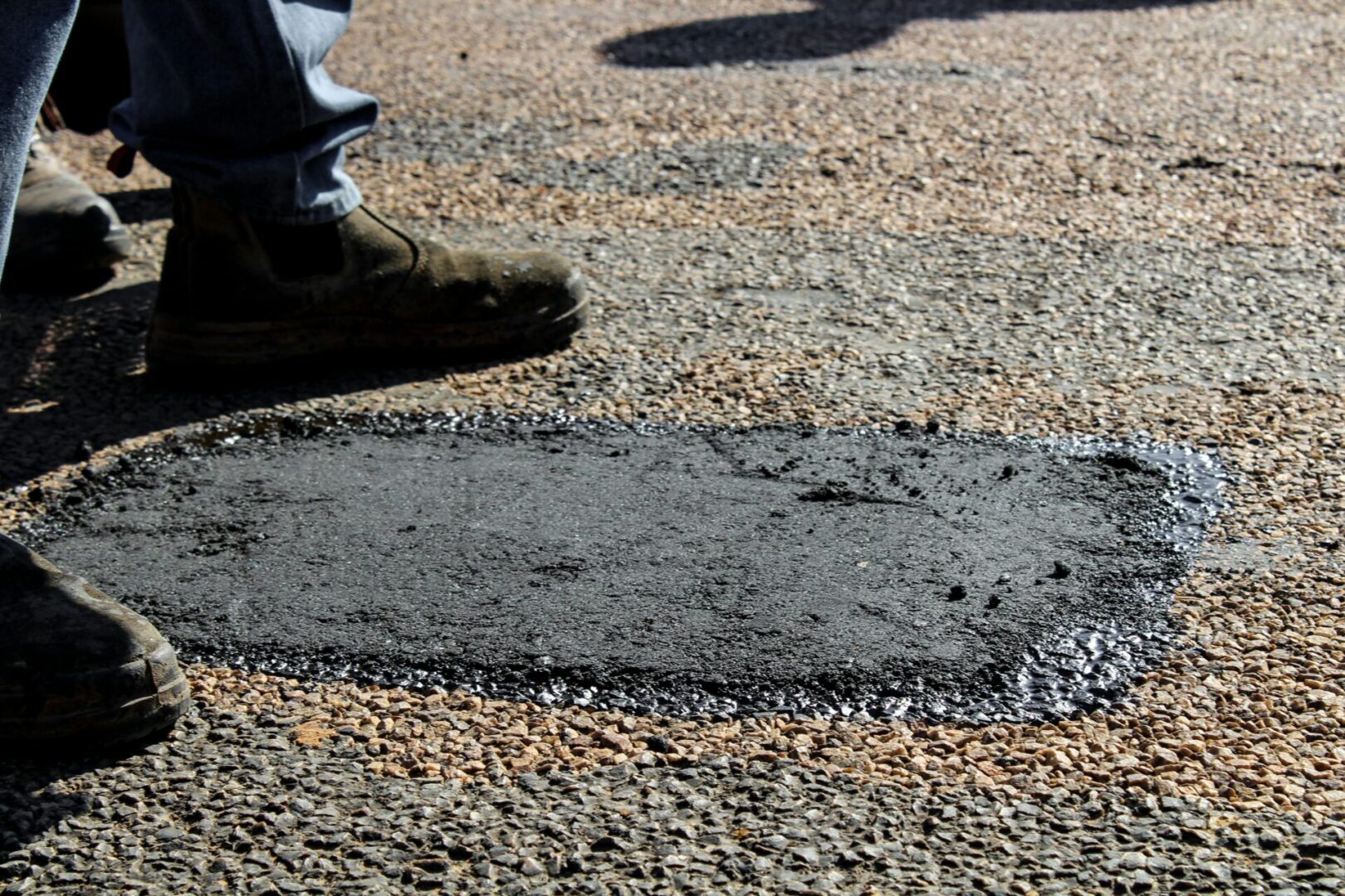 A person standing on the ground with their feet on the ground.